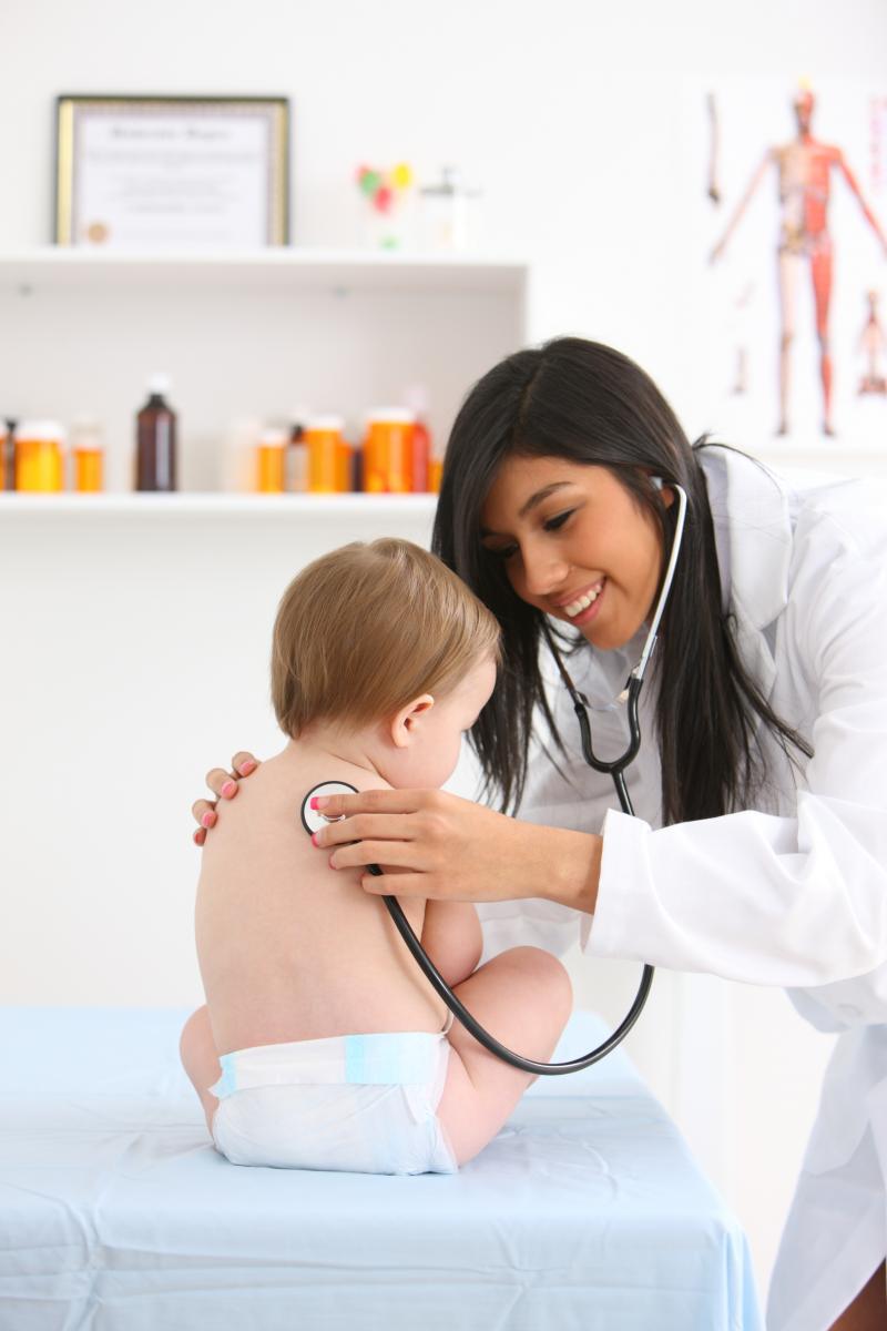 latina pediatrician with baby